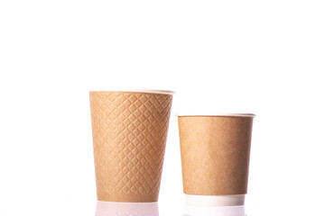 Modern kraft disposable brown paper cups small medium sizes isolated on white background. Coffee to go, takeaway hot drinks, Recycling, eco-friendly tableware concept, mockup template. Copy space