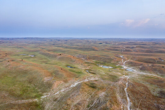 landscape of Nebraska Sandhills, early morning aerial view at Nebraska National Forest with cattle water holes