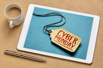 Cyber Monday sign - a paper price tag displayed on screen of a digital tablet, online holiday shopping concept
