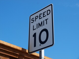 A speed limit sign found on an alley. This alley was a straight-a-way for blocks.