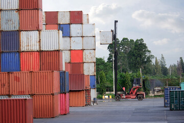 Fototapeta premium Industrial container crane carrying containers in cargo ships Container ship in logistics company, import and export business Industry and transportation concept