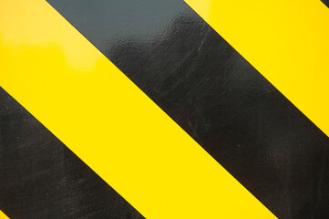 Yellow and black lines of a crane. Caution. Ship building industry. Netherlands. Shipyard.