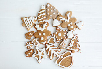 Tasty homemade gingerbread reindeer, tree, star and hearts cookies with icing