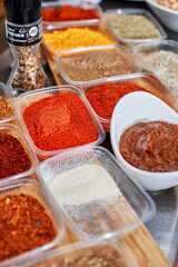 Many different spices, vegetables and ingredients, and fresh herbs for making homemade sauce