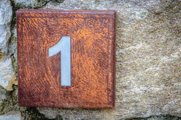 Number one on a rusty plate