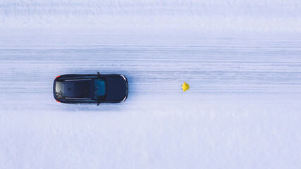 Aerial view, person traveler stopped on road during winter trip, car is broken and stands on the...