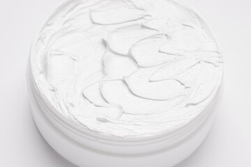 White cream in a jar close up