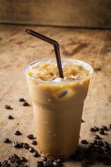 latte in glass on wooden table