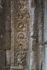 Various sculptures on the wall of Ta Prohm temple, Siem Reap, Cambodia.