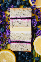 Slice of cake in the section on the background of fruit
