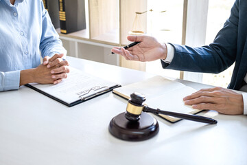 Businesswoman and Male lawyer or judge consult and conference having team meeting with client at...