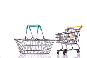 empty shopping trolley and basket isolated on white background. Shopping concept. shortage of critical supplies as Corona Virus COVID-19 fears drive crowds to hoard supplies, food, medicine