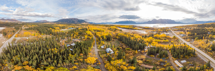 Amazing view of the road highway to Atlin, northern British Columbia with fall scenes and yellow autumn colors. Taken near the Yukon Territory border in Canada. 