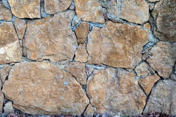 Stone wall grunge texture background facing decor.