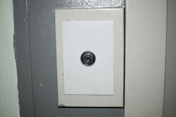 old elevator call button at the entrance
