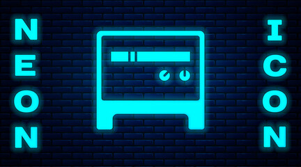 Glowing neon Guitar amplifier icon isolated on brick wall background. Musical instrument. Vector.