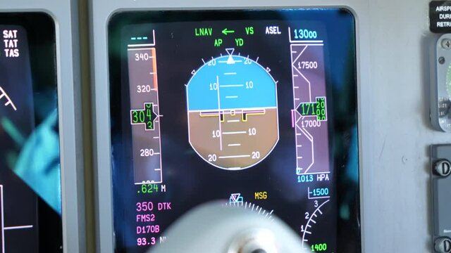 Close Up View Of Primary Flight Display (PFD) In The Airplane Cockpit Showing Flight Informations Such As Airspeed, Altitude, And Vertical Speed. Attitude Indicator (AI) In The Middle Of The Screen