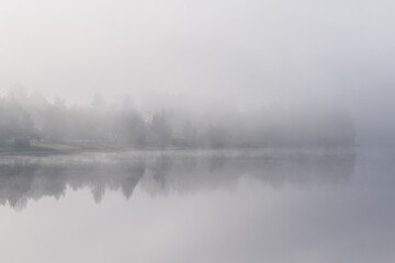 Fog over a lake in the morning in Lipno Nad Vltavou, Czech Republic