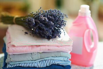 pile of clothes, softener and bunch of lavender