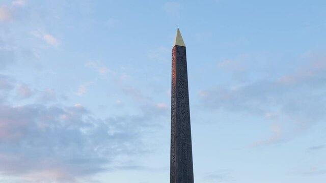 Luxor obelisk alone at place de la concorde in Paris with early morning sky and first rays of sun