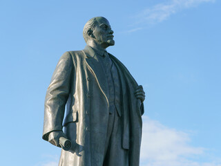 Fototapeta premium Famous Vladimir Lenin statue at the Exhibition of Achievements of National Economy (VDNKh) in Moscow. Blue summer sky as background. Historical heritage concept.