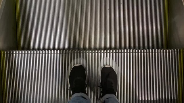 POV Of Female Woman Descending In Electric Stairs At A Shopping Mall While Social Distancing, Coronavirus Pandemic