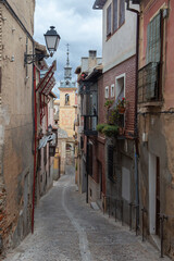 Narrow and old streets with stone and mud buildings in the city of Toledo