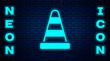 Glowing neon Traffic cone icon isolated on brick wall background. Vector.