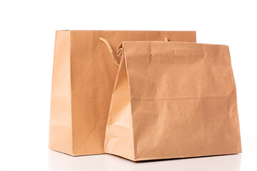 Two disposable biodegradable kraft paper bags isolated on white background. recycling and ecology concept. Eco-friendly materials. eco friendly modern ecological biomaterials. Zero waste concept.