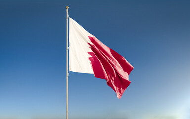 Quatar national  flag waving against blue sky background. Isolated.