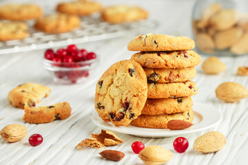 Freshly baked homemade Christmas cookies with cranberries, almonds and white chocolate. Delicious festive biscuit. Gingerbreads. Selective focus