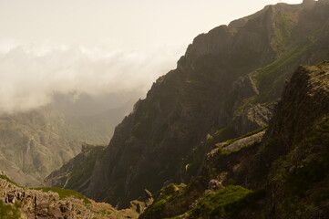Fototapeta na wymiar Hiking on the mountain ridge of Madeira Island on the way to Pico Ruivo, Portugal