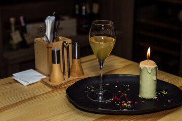 Candle with wine or champagne. Romantic atmosphere