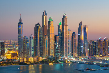 Plakat Dubai Marina skyscrapers and Jumeirah beach at sunrise, United Arab Emirates