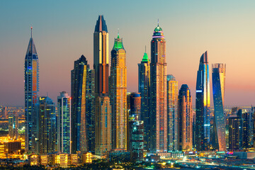 Fototapeta na wymiar Dubai Marina skyscrapers and Jumeirah beach at sunrise, United Arab Emirates