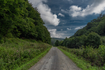 Fototapeta na wymiar Green forests and road to Slovakia Poland border near national park Poloniny