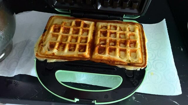 Lifting Top to Reveal Cooked Cheese Jaffle Waffle Toasties Slow motion / High Frame Rate