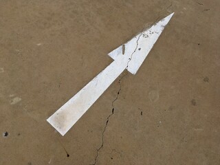 arrow sign on the wall