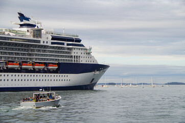 Modern luxury cruiseship or cruise ship liner docked at pier and terminal in Portland, Maine during...