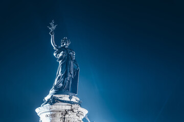 Monument à la République at the center of The Place de la République square, topped by a statue...