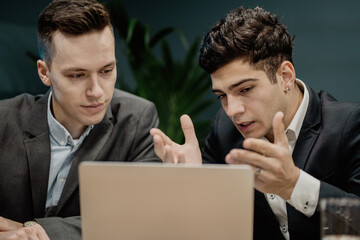 Man managers are discussing a new project work strategy for their business development good mood...