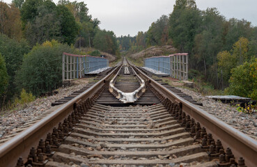 Obraz premium Railway in the forest.River bridge.Autumn forest