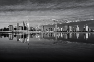 View on Dubai skyline with reflection at the sunrise, Dubai, United Arab Emirates 
