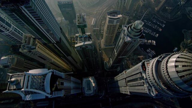 A breathtaking birds-eye view of the Princess Tower slowly revealing neighboring skyscrapers as it turns around and closes in onto the building, Aerial, 6-axis stabilized gimbal, F1, 8K, parallax.