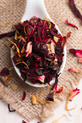 Dry red floral fruit and herbal hibiscus tea with petals 