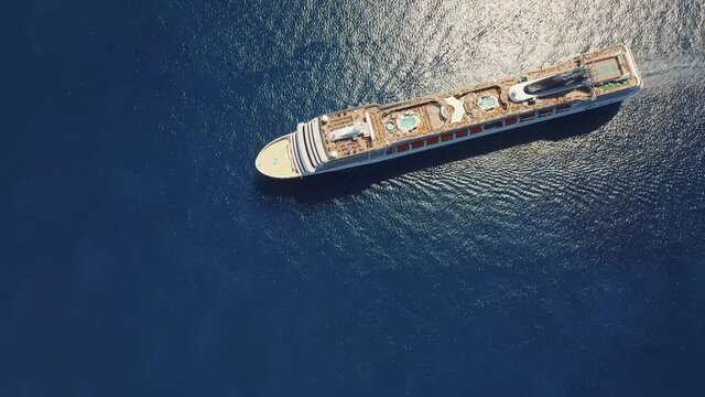 Stunning top down shot in 4k of cruise ship MSC Orchestra in calm blue water - 4k drone footage - Amazing view in UHD - Mediterranean Sea