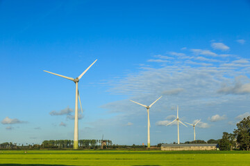 Dutch polder landscape with modern windturbines for the sustainable production of electricity for the climate-neutral production of Heineken Beer for the Dutch and European markets