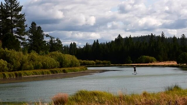 Stand up paddle boarder on the Deschutes River, Oregon