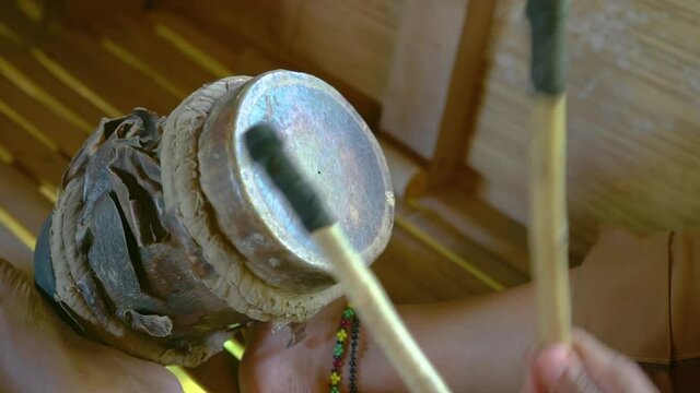Playing a Native Filipino Percussion Instrument T'Nonggong from T'Boli Tribe