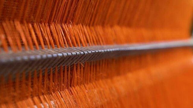 Orange Dyed Abaca Thread Closeup Going in Focus